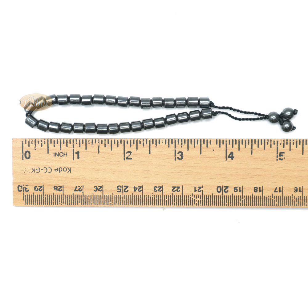 Black cylindrical-bead Islamic tasbih bracelet with adjustable cord.