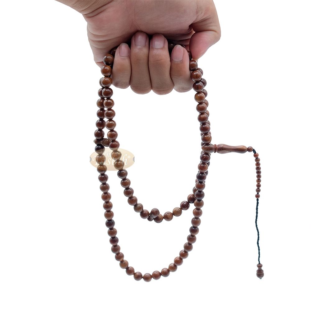 Brown wooden Islamic misbaha prayer beads with 99 beads and a black tassel cord.