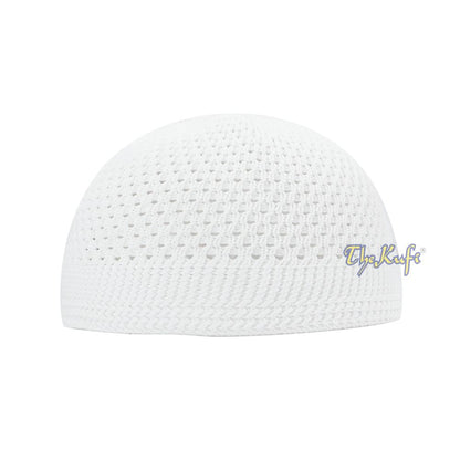 White knitted Islamic prayer cap (kufi) with breathable mesh pattern.