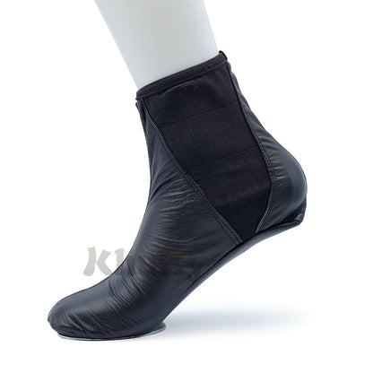 Black leather khuff socks for wudu and Islamic ablution, shown on a mannequin foot.