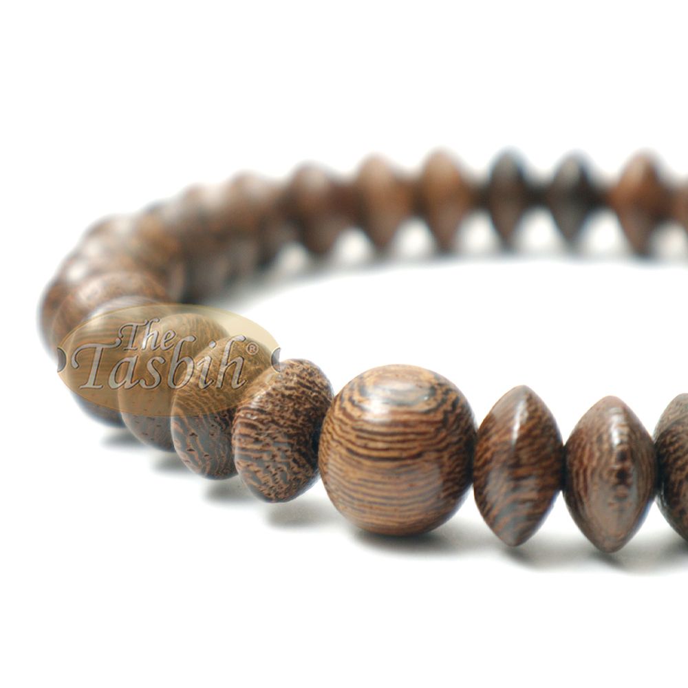 Brown wooden tasbih bracelet with oval textured beads from TheTasbih.com.