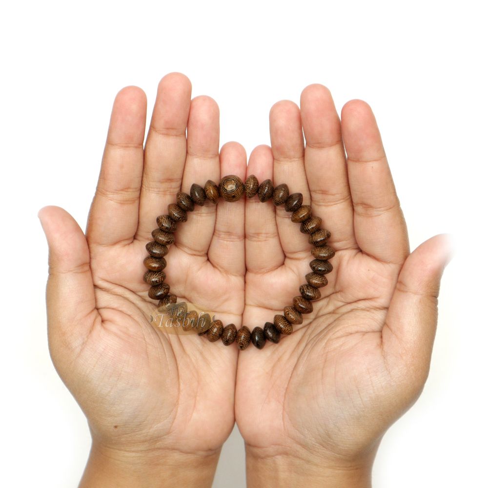 Brown wooden tasbih bracelet with oval textured beads from TheTasbih.com.