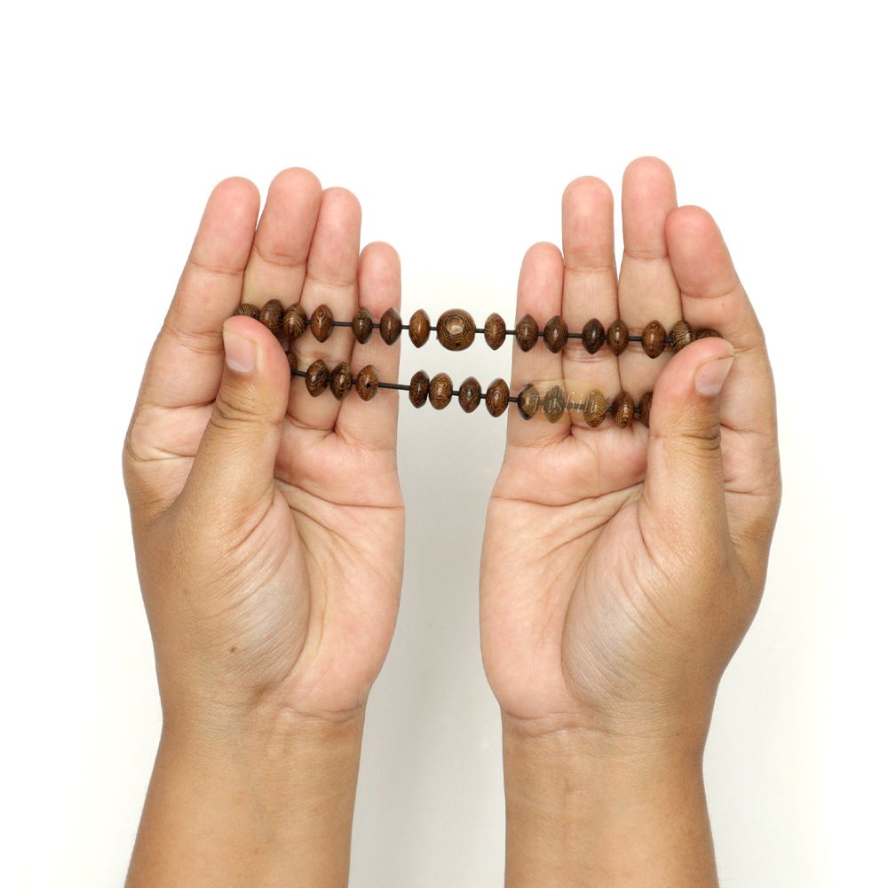 Brown wooden tasbih bracelet with oval textured beads from TheTasbih.com.