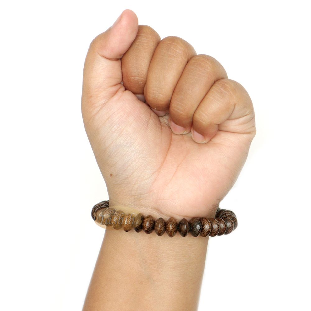 Brown wooden tasbih bracelet with oval textured beads from TheTasbih.com.