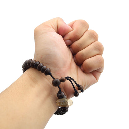 Brown wooden tasbih bracelet with adjustable braided cord.