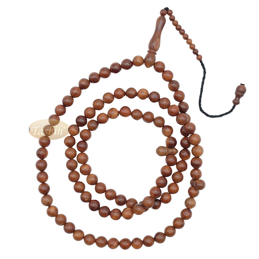 Brown wooden Islamic misbaha prayer beads with 99 beads and a black tassel cord.